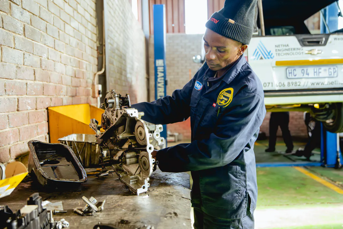 Technician completing engine work