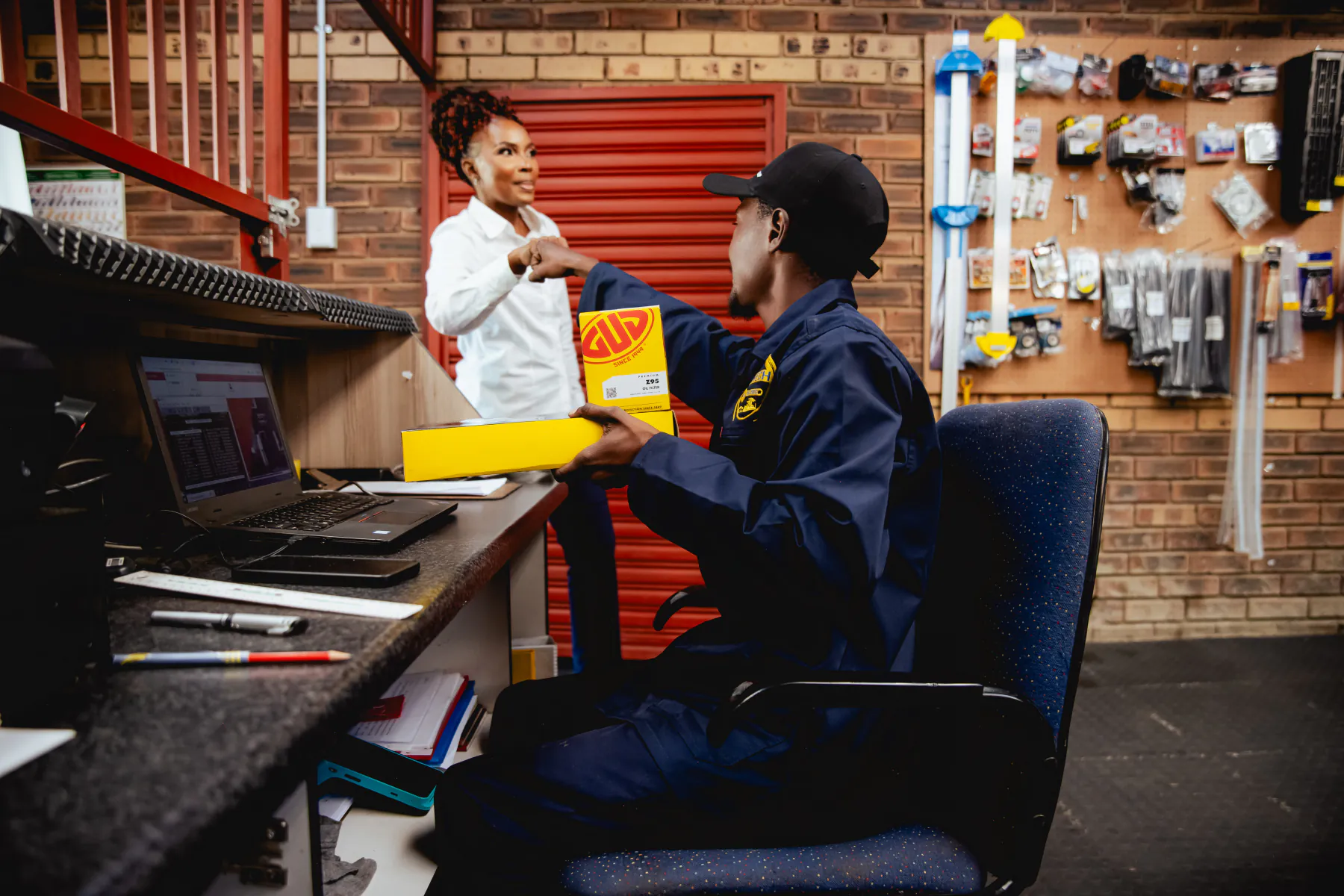 The Womech team assisting in the spares shop