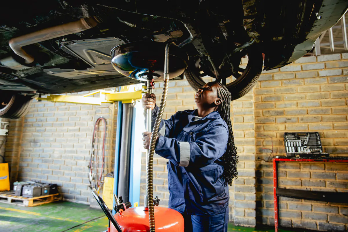 Womech technician servicing a vehicle